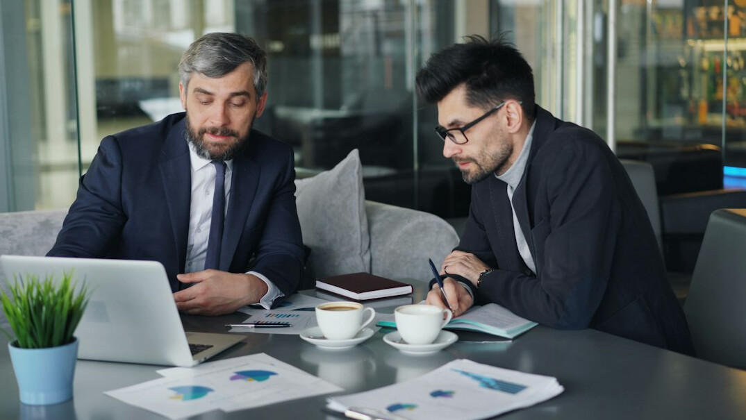 corporate team analyzing financial charts