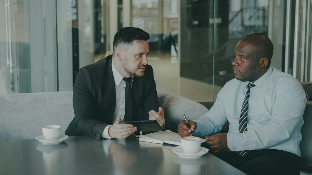 financial advisor consulting with business owners