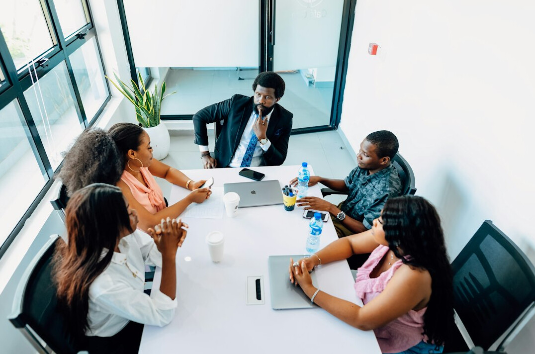 business executives in merger meeting